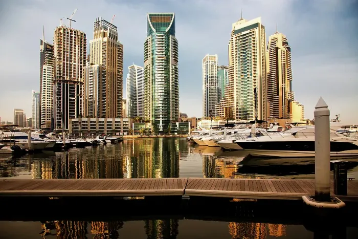 Framed Print : View of modern skyscrapers shining in sunrise lights in Dubai Marina in Dubai, United Arab Emirates Framed Print : View of modern skyscrapers shining in sunrise lights in Dubai Marina in Dubai, United Arab Emirates