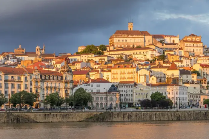Framed Print : View from Mondego River to the old town with the university on top of the hill at sunset Framed Print : View from Mondego River to the old town with the university on top of the hill at sunset