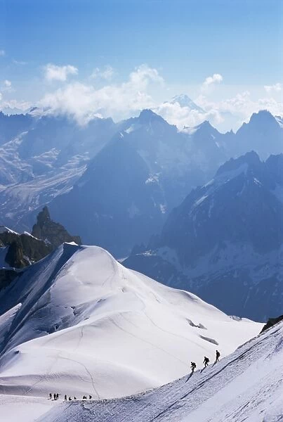 View from Mont Blanc towards Grandes Jorasses, with mountaineers on Cosmiques Ridge