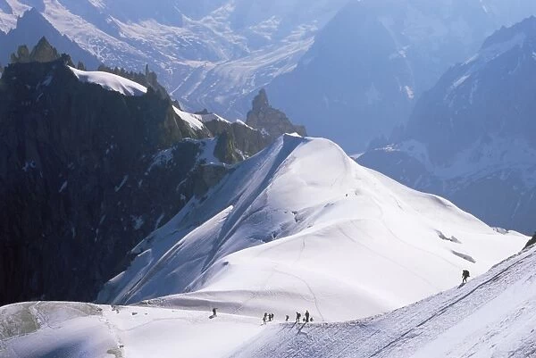 View from Mont Blanc towards Grandes Jorasses, with mountaineers on Cosmiques Ridge