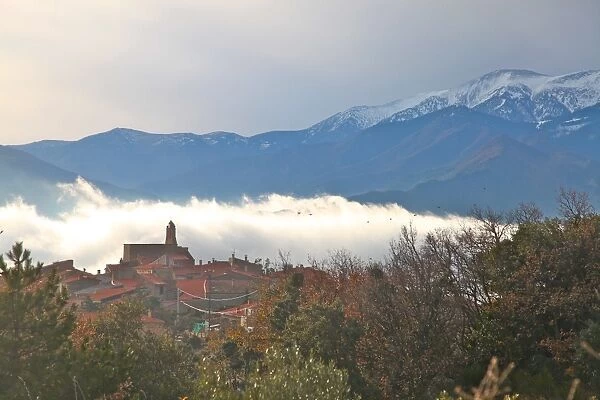 View of morning mist and Arboussols, village in the Pyrenees, Pyrenees-Orientales, Languedoc-Roussillon, France, Europe
