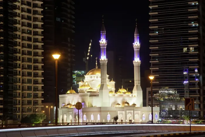 Framed Print : View of mosque and modern skyscrapers at night in Dubai Marina in Dubai, United Arab Emirates Framed Print : View of mosque and modern skyscrapers at night in Dubai Marina in Dubai, United Arab Emirates