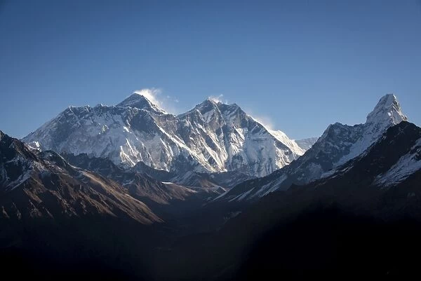 A view of Mount Everest, distant peak to the left behind the Nuptse-Lhotse ridge