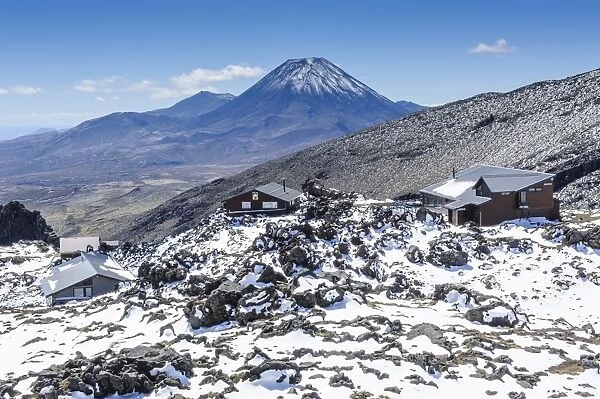 View from Mount Ruapehu of Mount Ngauruhoe with a ski cottage in the foreground, Tongariro National Park, UNESCO World Heritage Site, North Island, New Zealand, Pacific