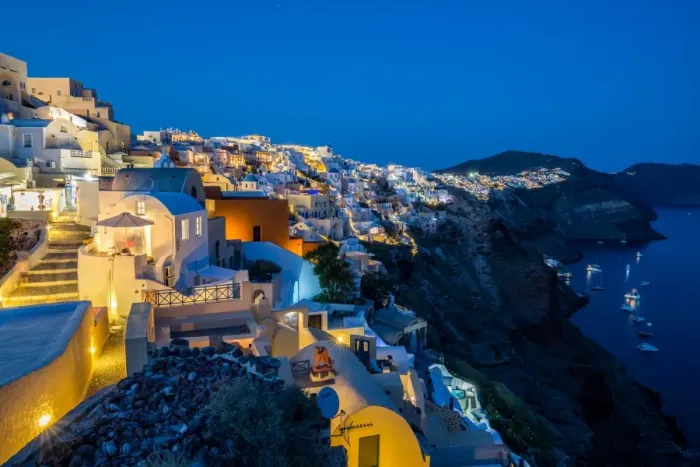 Framed Print : The view from Oia castle along Santorinis caldera during the evening blue hour with Framed Print : The view from Oia castle along Santorinis caldera during the evening blue hour with