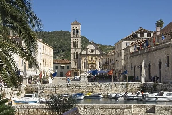 View from the old harbour across the main square to St. Stephens Cathedral, in the medieval city of Hvar, island of Hvar, Dalmatia, Croatia, Europe