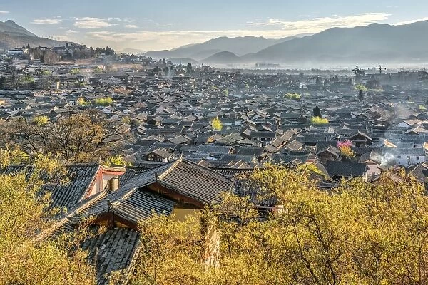 A view over the Old Town area of Lijiang (Dayan), UNESCO World Heritage Site, and its roofs on a clear morning, Lijiang, Yunnan, China, Asia