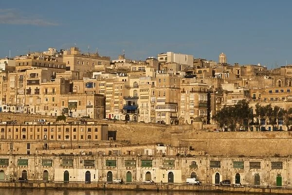 View of the old town from the Grand Harbour in the golden early morning, Valletta, Malta, Europe