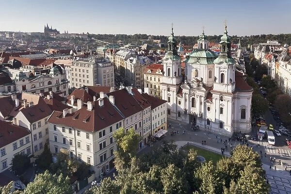 View over the Old Town Square (Staromestske namesti) to St. Nicholas Church and Castle District with Royal Palace and St. Vitus Cathedral, Prague, Bohemia, Czech Republic, Europe