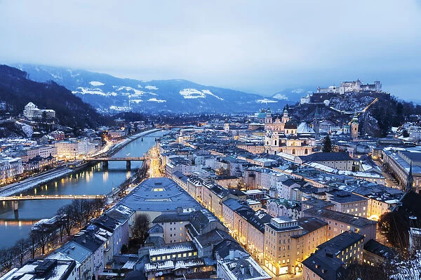 View over the old town, UNESCO World Heritage Site, and Hohensalzburg Castle at dusk