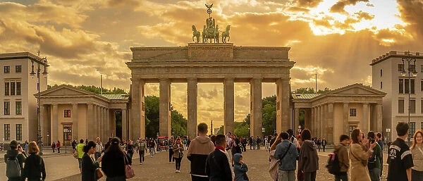 View of people gathered at Brandenburg Gate at sunset, Pariser Square, Unter den Linden, Berlin, Germany, Europe
