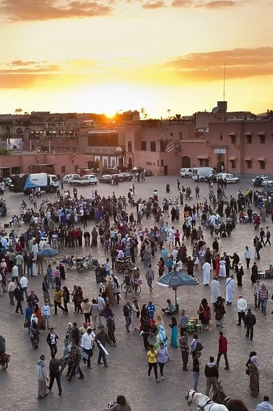 View over people in the Place Djemaa el Fna at sunset, Marrakech, Morocco, North Africa, Africa