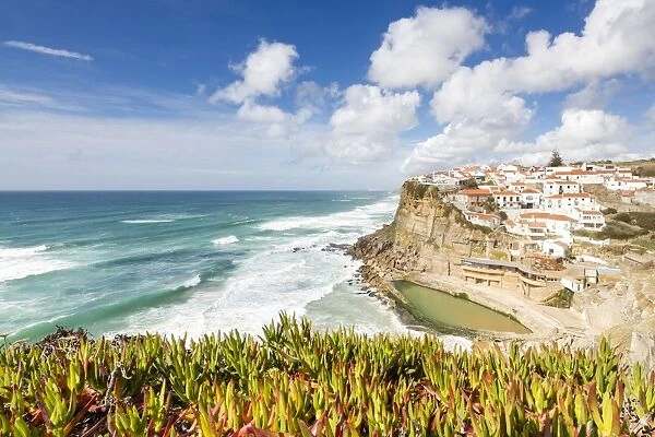 Top view of the perched village of Azenhas do Mar surrounded by the Atlantic Ocean