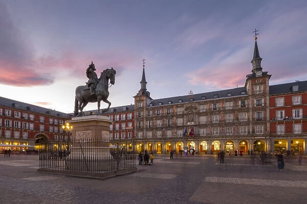 View of Philip lll statue and architecture in Calle Mayor at dusk, Madrid, Spain, Europe