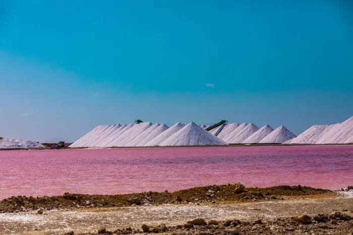 Framed Print : View of the pink colored ocean overlooking the Salt Pyramids of Bonaire from afar Framed Print : View of the pink colored ocean overlooking the Salt Pyramids of Bonaire from afar