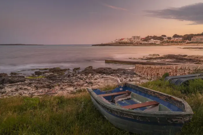 Framed Print : View of Playa Punta Prima and rowing boat at dusk, Punta Prima, Menorca, Balearic Islands, Spain, Mediterranean, Europe Framed Print : View of Playa Punta Prima and rowing boat at dusk, Punta Prima, Menorca, Balearic Islands, Spain, Mediterranean, Europe