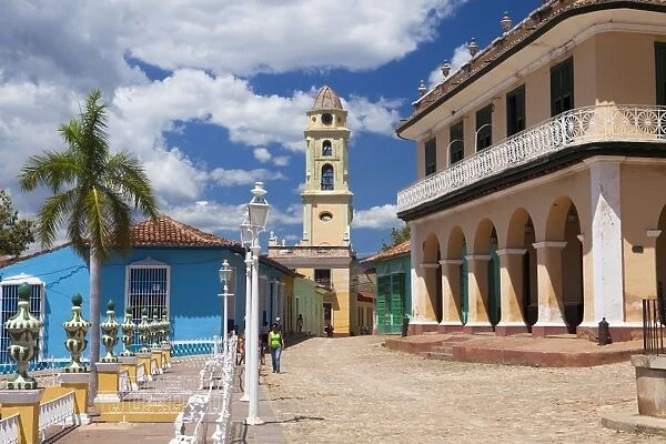 View across Plaza Mayor towards Museo Romantico and the belltower of The Convento de San Francisco de Asis, Trinidad, UNESCO World Heritage Site, Cuba, West Indies, Central America