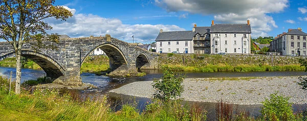 View of Pont Fawr (Inigo Jones Bridge) over Conwy River and riverside houses, Llanrwst