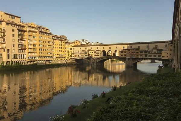 View of Ponte Vecchio, a medieval stone arch bridge on the Arno River, one of the