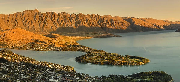 View over Queenstown and Lake Wakatipu to The Remarkables Mountains at sunset, Otago
