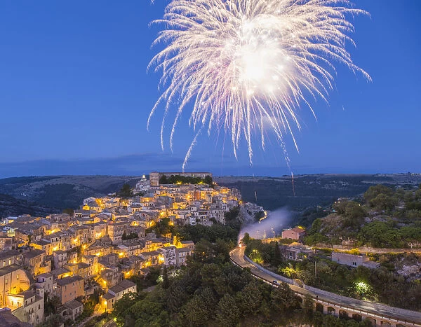 View over Ragusa Ibla, dusk, fireworks marking the Festival of San Giorgio, Ragusa