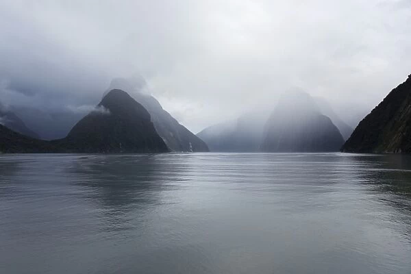 View down rainswept Milford Sound, mountains obscured by cloud, Milford Sound, Fiordland