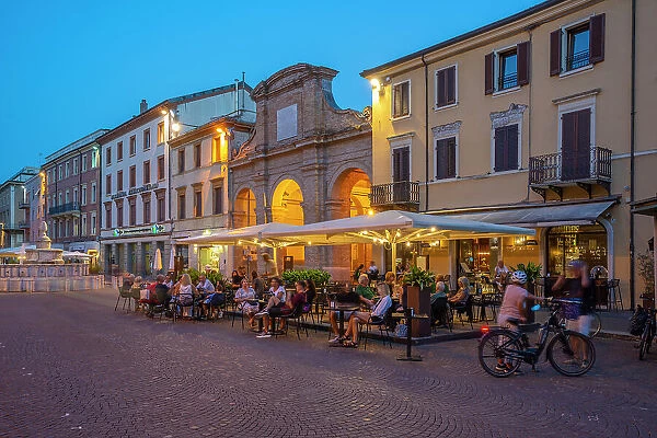 View of restaurant in Piazza Cavour in Rimini at dusk, Rimini, Emilia-Romagna, Italy, Europe
