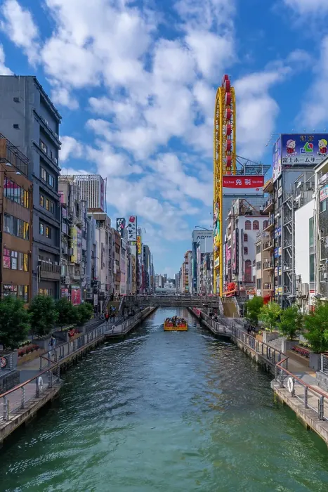 Framed Print : View of restaurants and tour boat in Dotonbori, vibrant entertainment district near the river, Osaka, Honshu, Japan