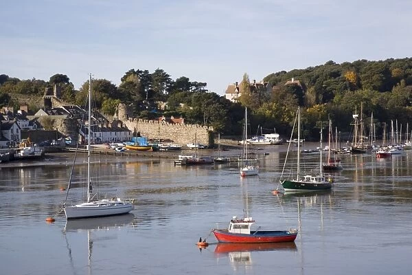View across river estuary to town wall quay and harbour