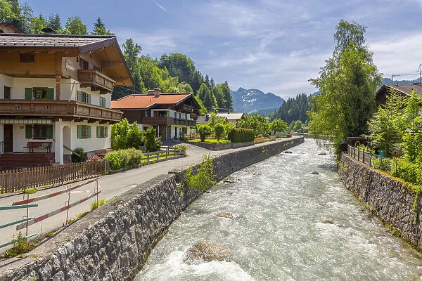 View of river through Fieberbrunn, Fieberbrunn, Austrian Alps, Tyrol, Austria, Europe