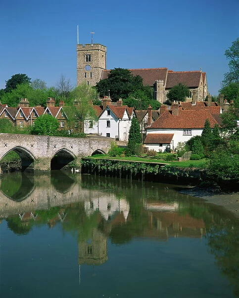 View across River Medway to village and church, Aylesford, Kent, England