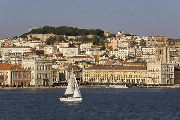 View from River Tagus, showing Praca Comercio, with demonstration, castle and cathedral, Lisbon, Portugal, Europe