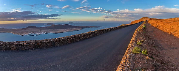 View of road and La Graciosa Island from Mirador del Rio at sunset, Lanzarote, Las Palmas, Canary Islands, Spain, Atlantic, Europe