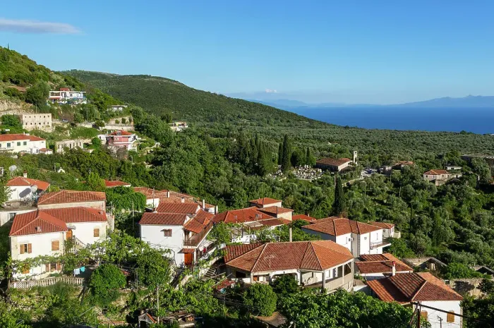 Framed Print : View over rooftops of homes in village of Vuno, towards Ionian Sea, near Himare, Albania, Europe Framed Print : View over rooftops of homes in village of Vuno, towards Ionian Sea, near Himare, Albania, Europe