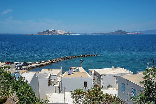 View of rooftops and the sea in the town of Mandraki, Mandraki, Nisyros, Dodecanese, Greek Islands, Greece, Europe