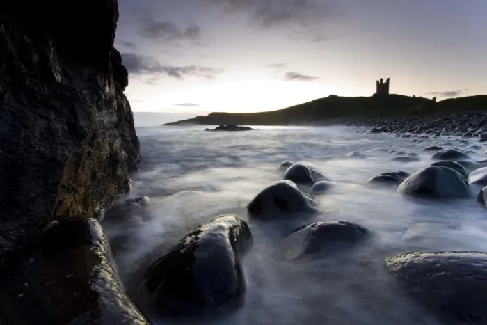 Framed Print : View across the Rumble Churn at dawn towards the ruins of Dunstanburgh Castle Framed Print : View across the Rumble Churn at dawn towards the ruins of Dunstanburgh Castle