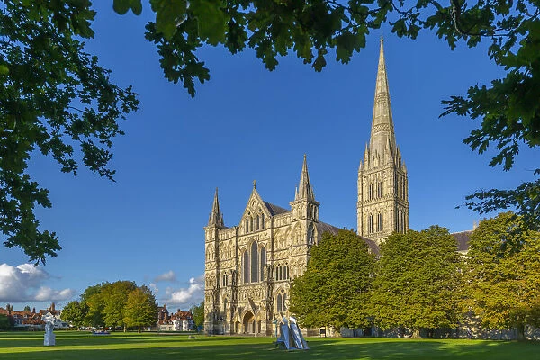 View of Salisbury Cathedral framed by trees, Salisbury, Wiltshire, England