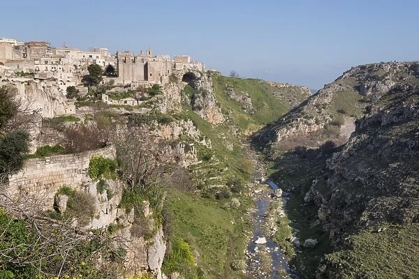 View of Sant Agostino Convent in the Sassi area of Matera and ravine, Basilicata, Italy, Europe