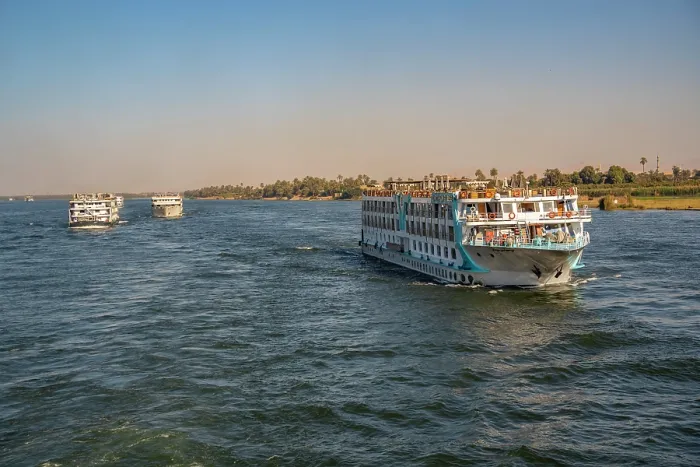 Framed Print : View of scenery and cruise boat from cruise boat near Armant on the Nile River, Luxor, Egypt, Africa Framed Print : View of scenery and cruise boat from cruise boat near Armant on the Nile River, Luxor, Egypt, Africa