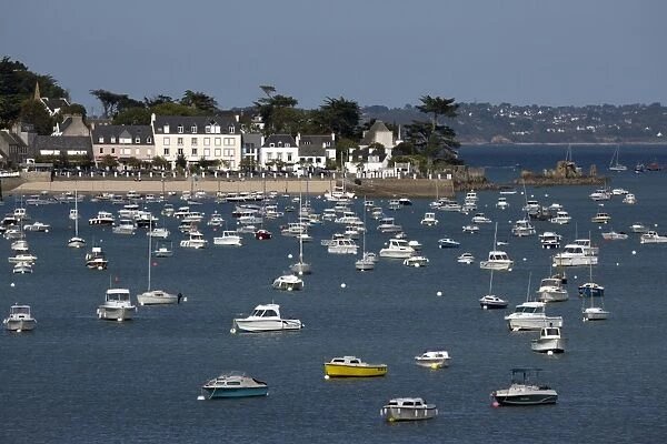 View over seaside village and boats in bay, Locquirec, Finistere, Brittany, France