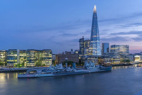 View of the Shard, HMS Belfast and River Thames from Cheval Three Quays at dusk, London