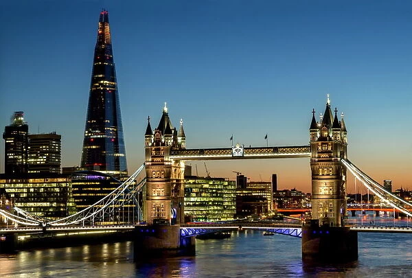View of the Shard and Tower Bridge standing tall above the River Thames at dusk, London, England, United Kingdom, Europe