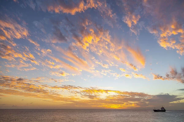 View of ship against West Coast sunset, Bridgetown, Barbados, West Indies, Caribbean