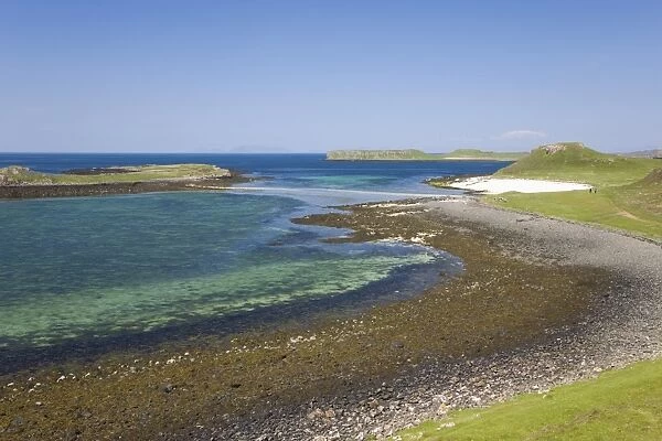 View over shore at low tide to distant Coral Beach, Claigan, near Dunvegan, Isle of Skye, Inner Hebrides, Highland, Scotland, United Kingdom, Europe