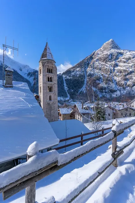 Framed Print : View of snow covered mountains, rooftops and Church of Saint Pantalon in Courmayeur in winter, Courmayeur, Aosta Valley, Italian Alps, Italy Framed Print : View of snow covered mountains, rooftops and Church of Saint Pantalon in Courmayeur in winter, Courmayeur, Aosta Valley, Italian Alps, Italy