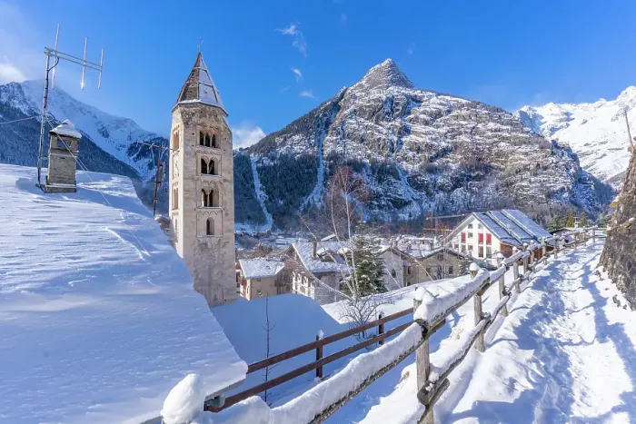 Framed Print : View of snow covered mountains, rooftops and Church of Saint Pantalon in Courmayeur in winter, Courmayeur, Aosta Valley, Italian Alps, Italy Framed Print : View of snow covered mountains, rooftops and Church of Saint Pantalon in Courmayeur in winter, Courmayeur, Aosta Valley, Italian Alps, Italy