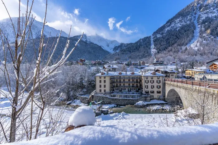 Framed Print : View of snow covered trees, mountains and Dolonne from Courmayeur in winter, Courmayeur, Aosta Valley, Italian Alps, Italy