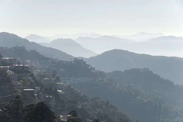 View south from Mussoorie over morning mist on foothills of Garwhal Himalaya, Uttarakhand, India, Asia