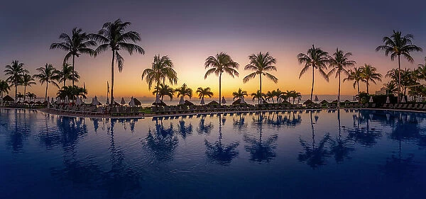 View of sunrise and hotel pool near Puerto Morelos, Caribbean Coast, Yucatan Peninsula, Mexico, North America