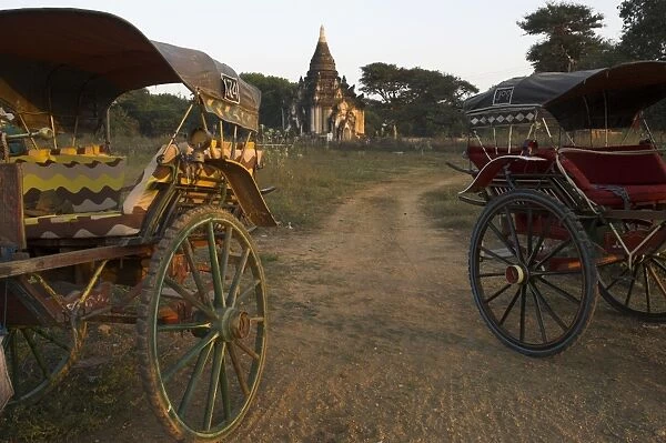 View at sunset with horse cart and typical temple, Bagan (Pagan), Myanmar (Burma), Asia